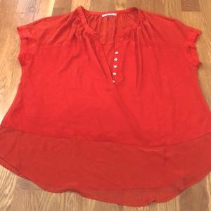 Orange sheer blouse.